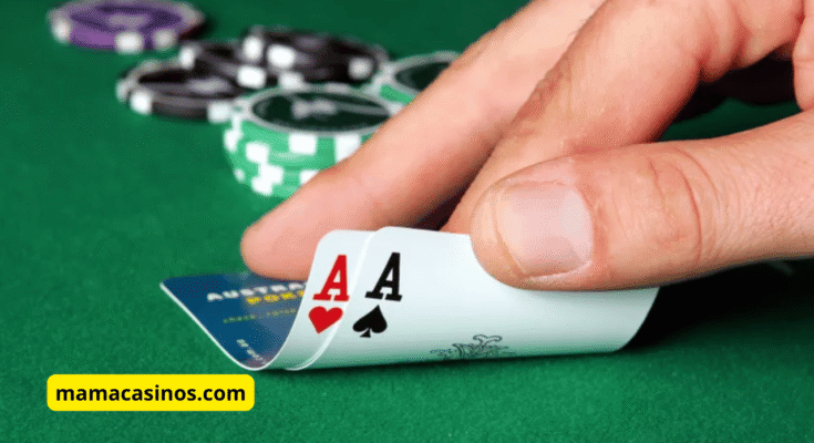 A pair of pocket aces (Pocket Rockets) in a poker game, with poker chips and cards on a table.