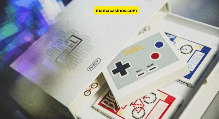 A flat lay of Bicycle playing cards, vintage Nintendo Hanafuda cards, and blank white cards on a wooden table with creative tools and a collector’s case.